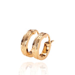 The picture shows a pair of 14K yellow gold mini hoop earrings with scroll engraving.