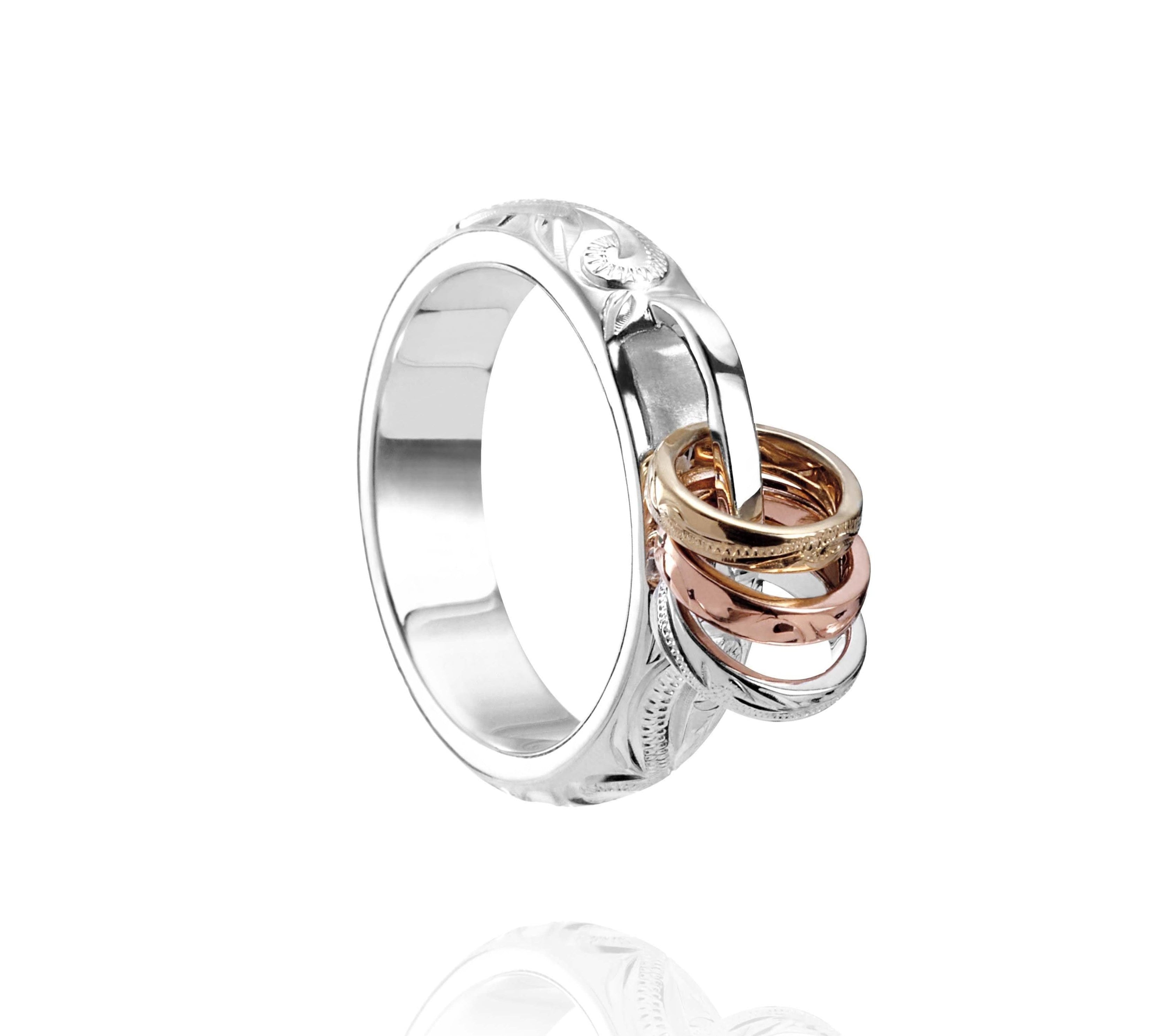 The picture shows a 14K white, yellow, and rose gold mini hoop tri-color ring.