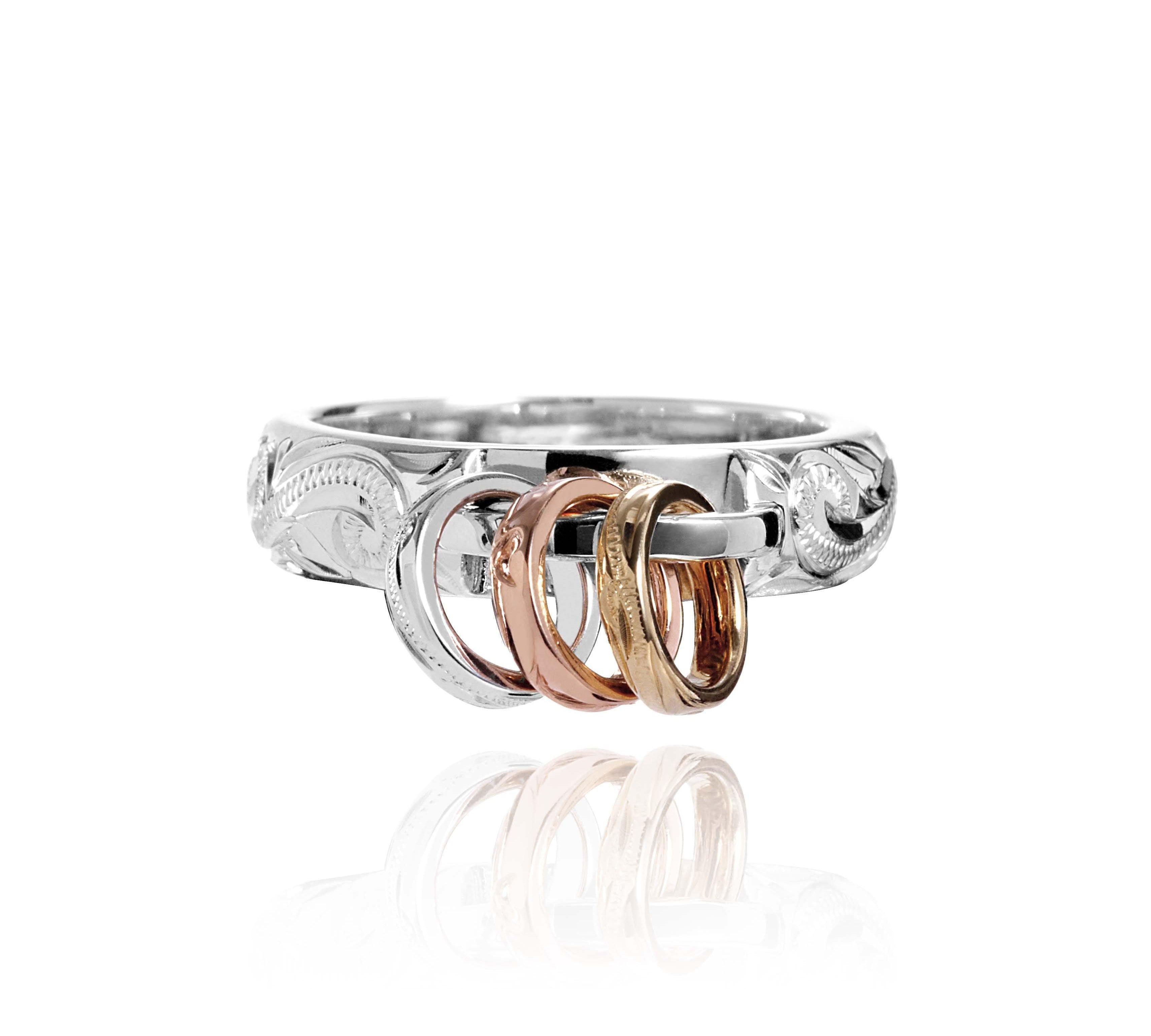 The picture shows a 14K white, yellow, and rose gold mini hoop tri-color ring.