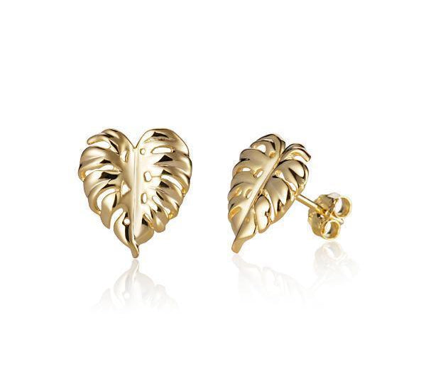 In this photo there is a pair of 14k yellow gold monstera stud earrings.