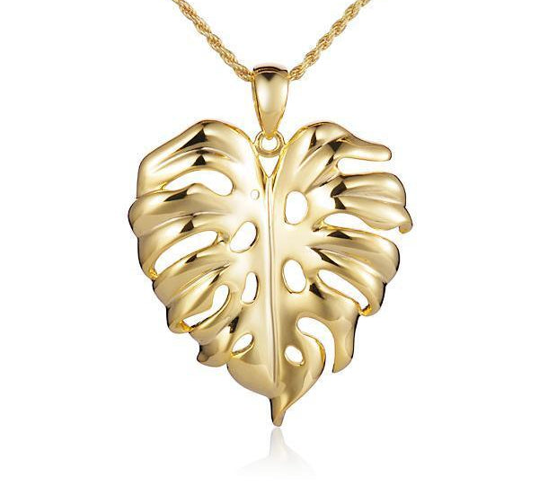 In this photo there is a yellow gold monstera pendant.