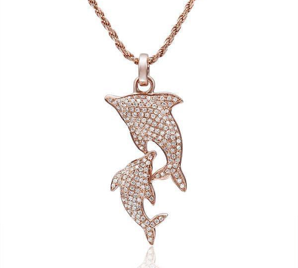The picture shows a 14K solid rose gold 2 dolphin pendant with diamonds.