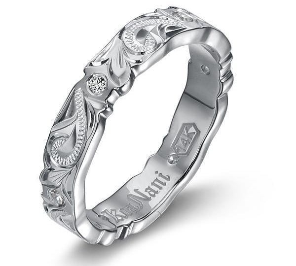 The picture shows a 14K white gold wave infinity ring with diamonds and hand engravings.