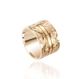 The picture shows a 14K yellow gold 12 mm ring with hand engravings.