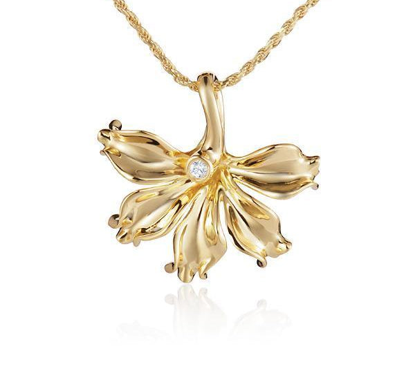 In this photo there is a yellow gold naupaka flower pendant with one diamond.