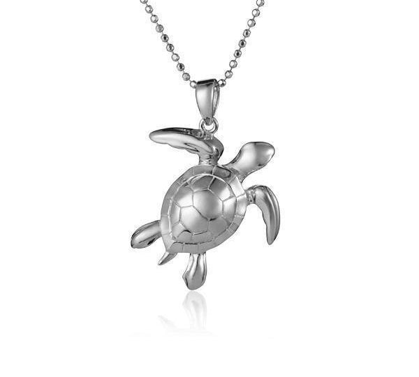 The picture shows a 14K white gold sea turtle pendant.