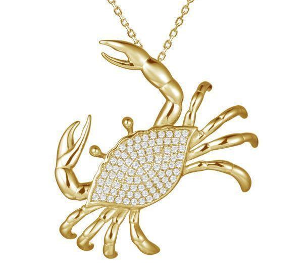 The picture shows a 14K yellow gold pavé diamond blue crab pendant.