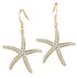 The picture shows a pair of 14K yellow gold pavé diamond sea star hook earrings.