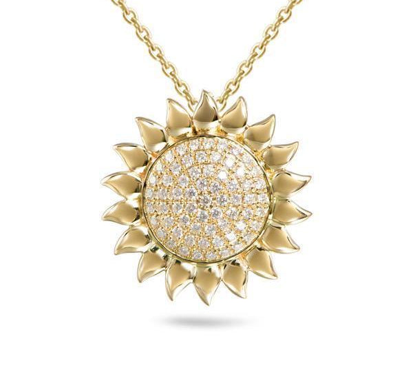 In this photo there is a yellow gold sunflower pendant with diamonds.