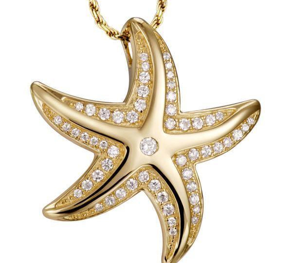 The picture shows a 14K yellow gold starfish pendant with pavé diamonds.