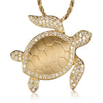 The picture shows a 14K yellow gold sea turtle pendant with diamonds.