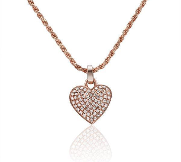 The picture shows a 14K rose gold pavé heart pendant with diamonds.