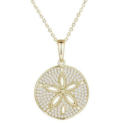 The picture shows a large 14K yellow gold pavé sand dollar pendant with diamonds.