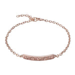 The picture shows a 14K rose gold plumeria bar bracelet with diamonds.