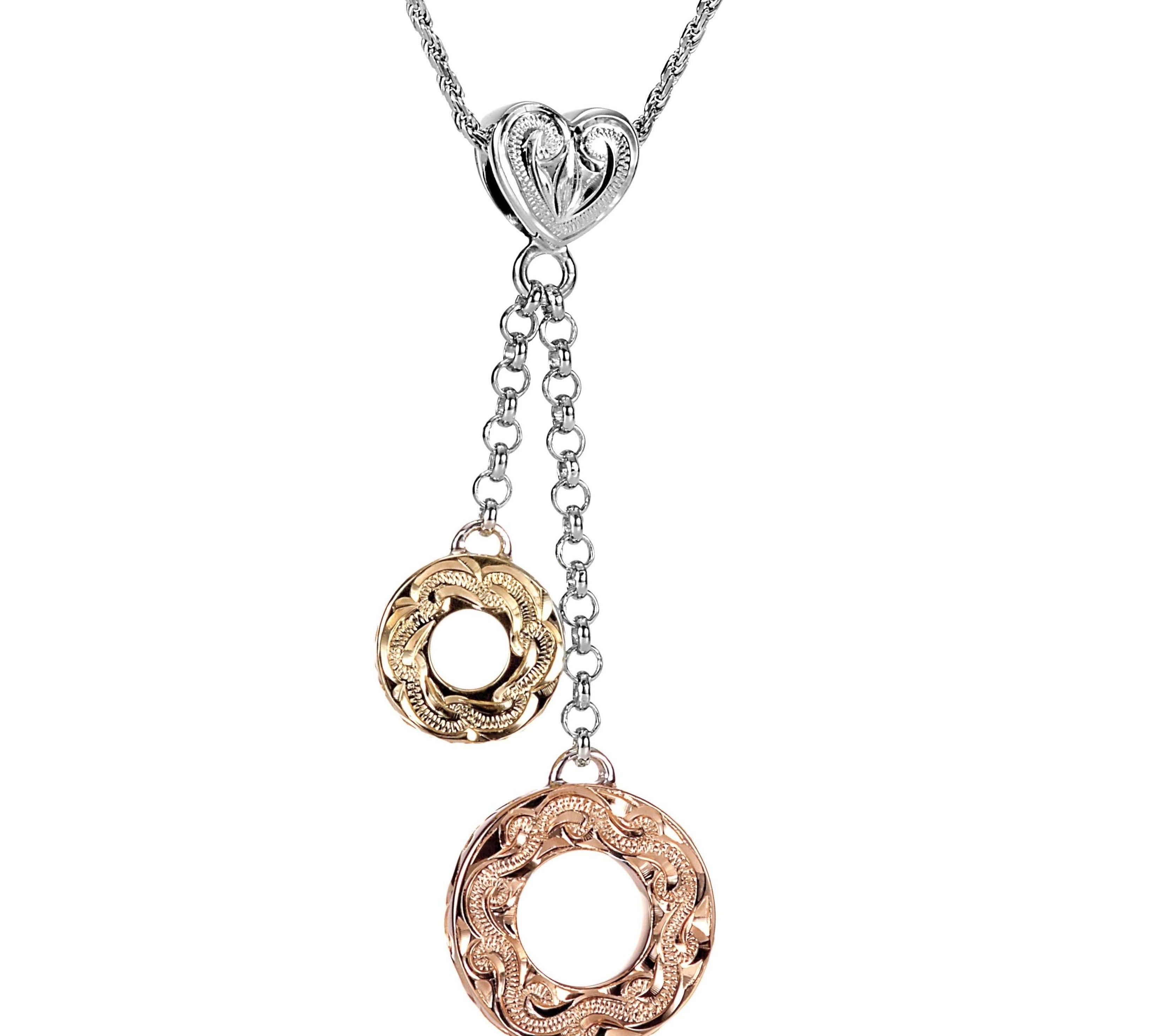 The picture shows a 14K rose and yellow gold two circles and one heart charm pendant with hand engravings.