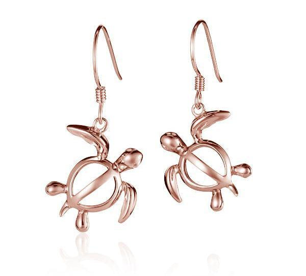 The picture shows a pair of 14K rose gold sea turtle hook earrings.