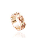 In this photo there is a rose gold ring with flower and scroll hand-engravings.