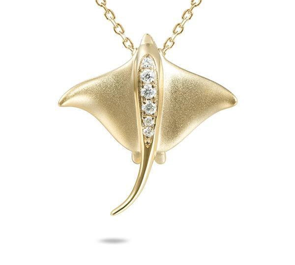 The picture shows a 14K yellow gold eagle ray pendant with diamonds.