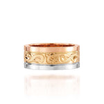 The picture shows a 14K rose, yellow, and white gold tricolor 8mm ring with hand engravings including sea turtles.