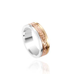 In this photo there is a yellow, rose, and white gold tricolor ring with flower and scroll hand engravings.