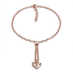 The picture shows a 14K rose gold heart bracelet with one diamond and hand-engravings.