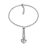 The picture shows a 14K white gold heart bracelet with one diamond and hand-engravings.