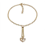 The picture shows a 14K yellow gold heart bracelet with one diamond and hand-engravings.
