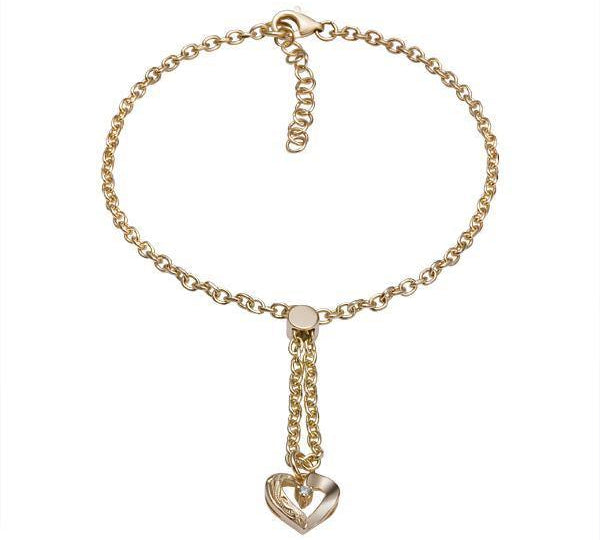 The picture shows a 14K yellow gold heart bracelet with one diamond and hand-engravings.
