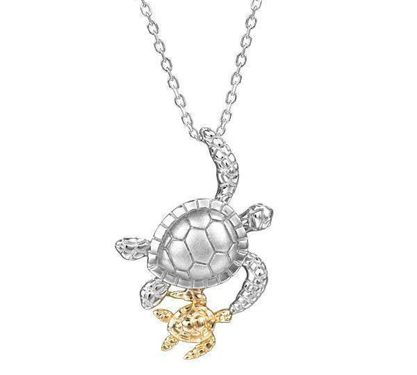The picture shows a 14K two-tone white and yellow gold pendant featuring two sea turtles.