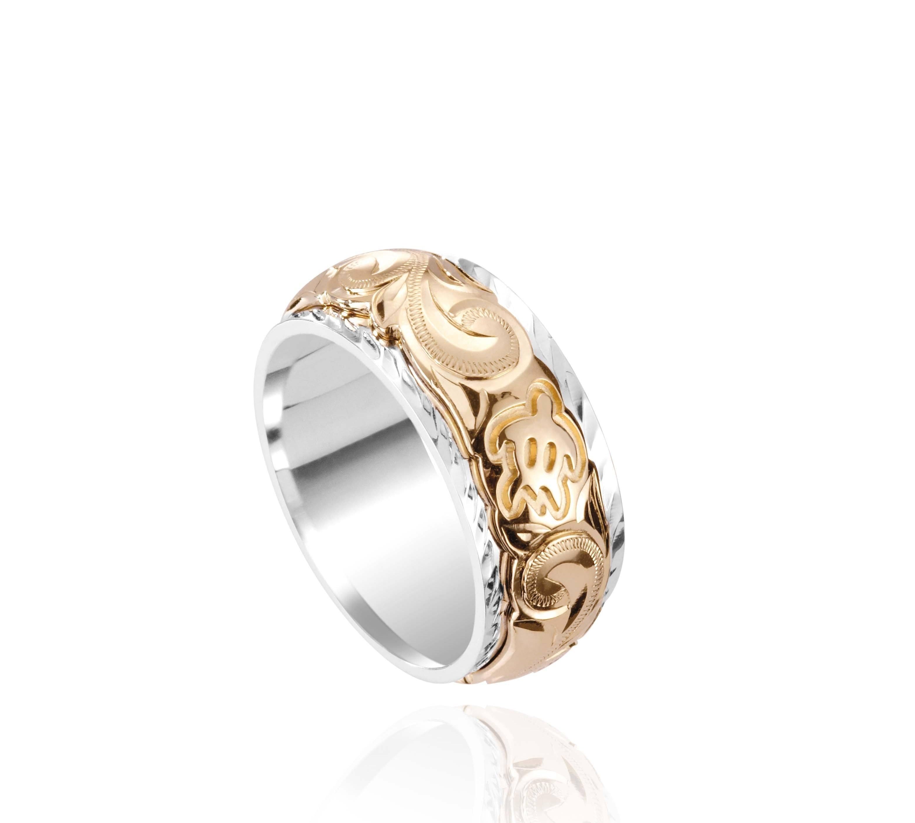The photo shows a two-tone 8 mm 14K yellow and white gold ring with hand engravings including a sea turtle.