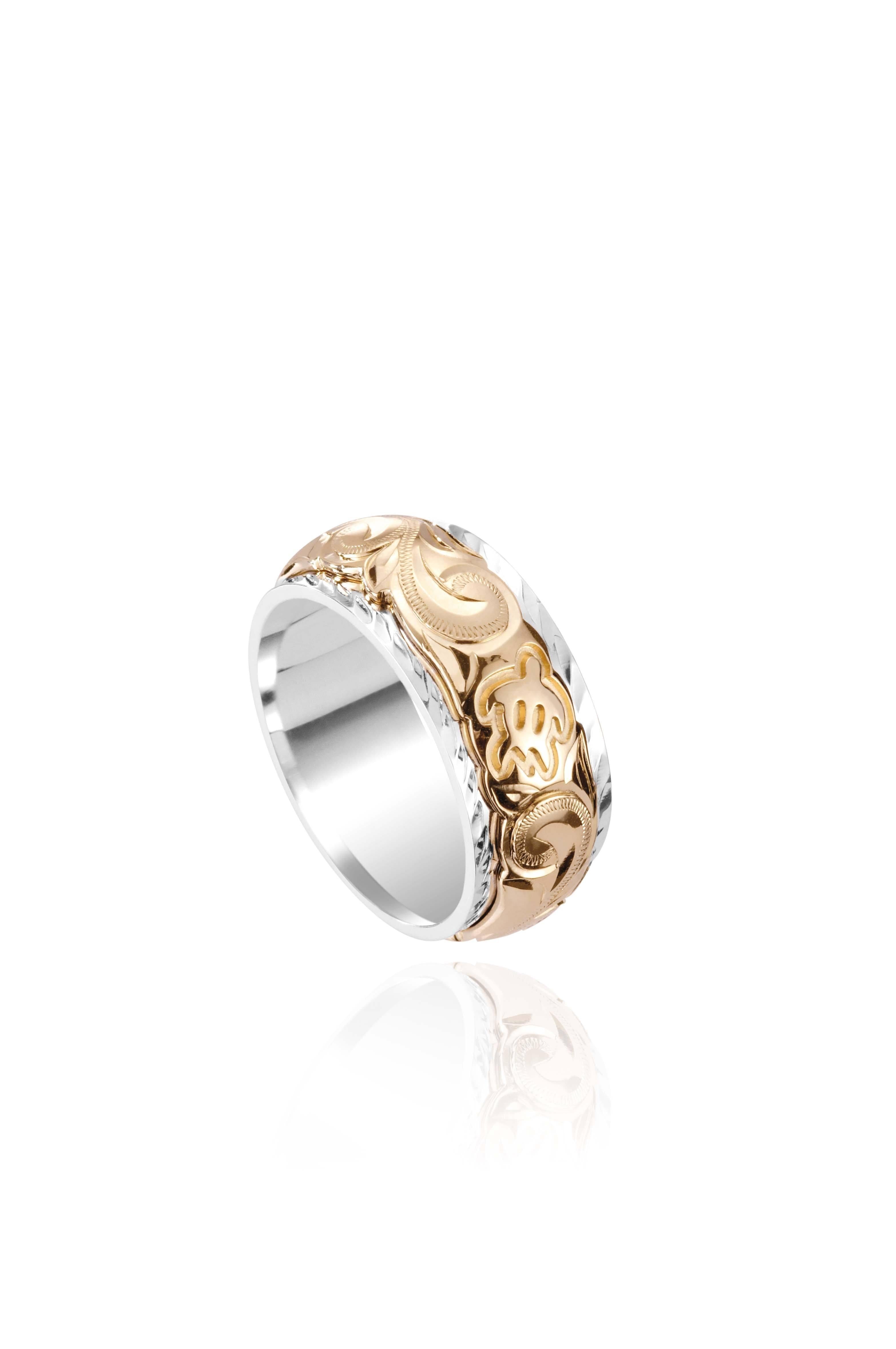 The photo shows a two-tone 8 mm 14K yellow and white gold ring with hand engravings including a sea turtle.
