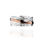 The picture shows a two-tone 925 sterling silver and 14K rose gold belted ring with hand-engravings.