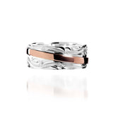 The picture shows a two-tone 925 sterling silver and 14K rose gold belted ring with hand-engravings.