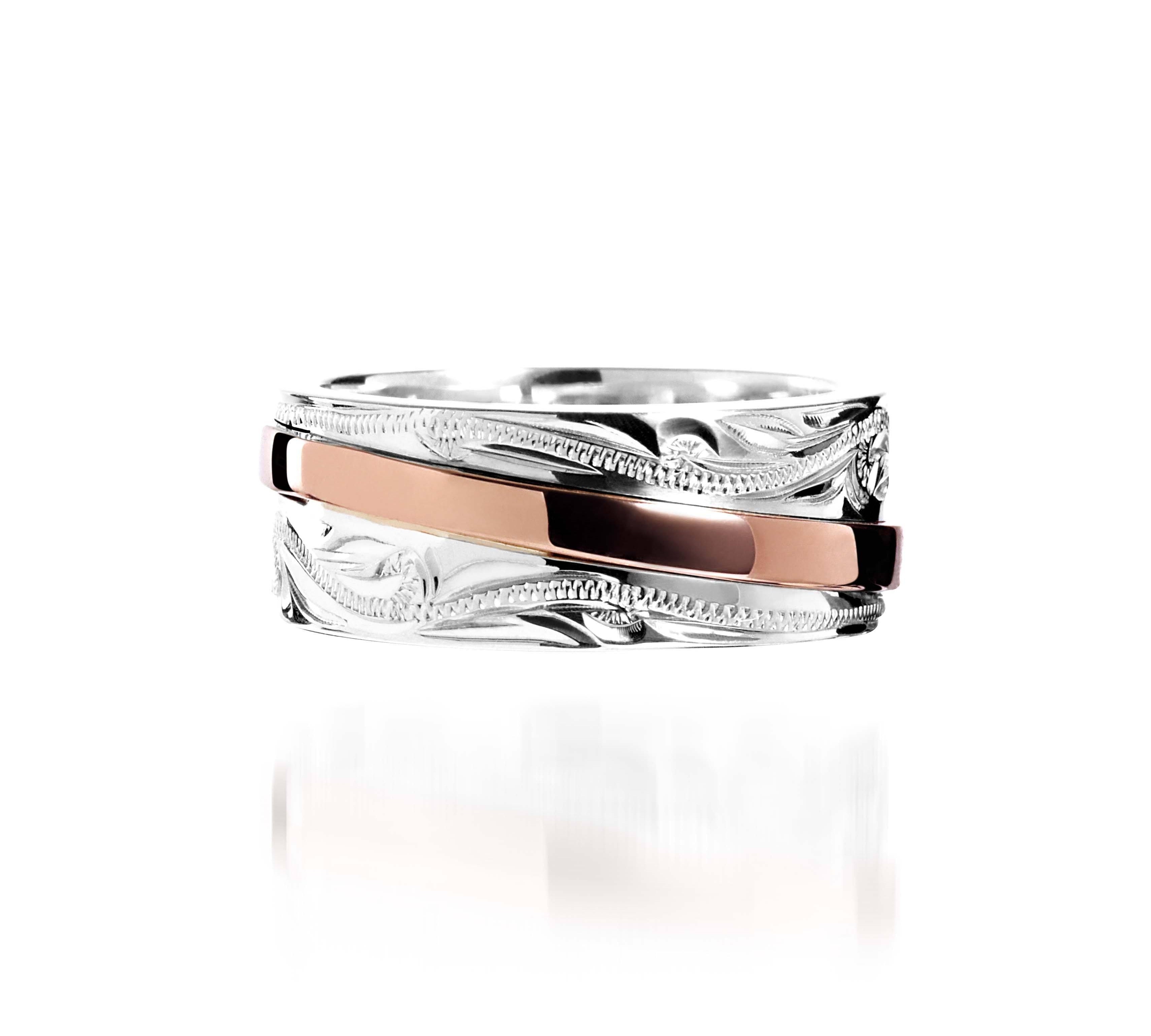The picture shows a two-tone 925 sterling silver and 14K rose gold belted ring with hand-engravings.