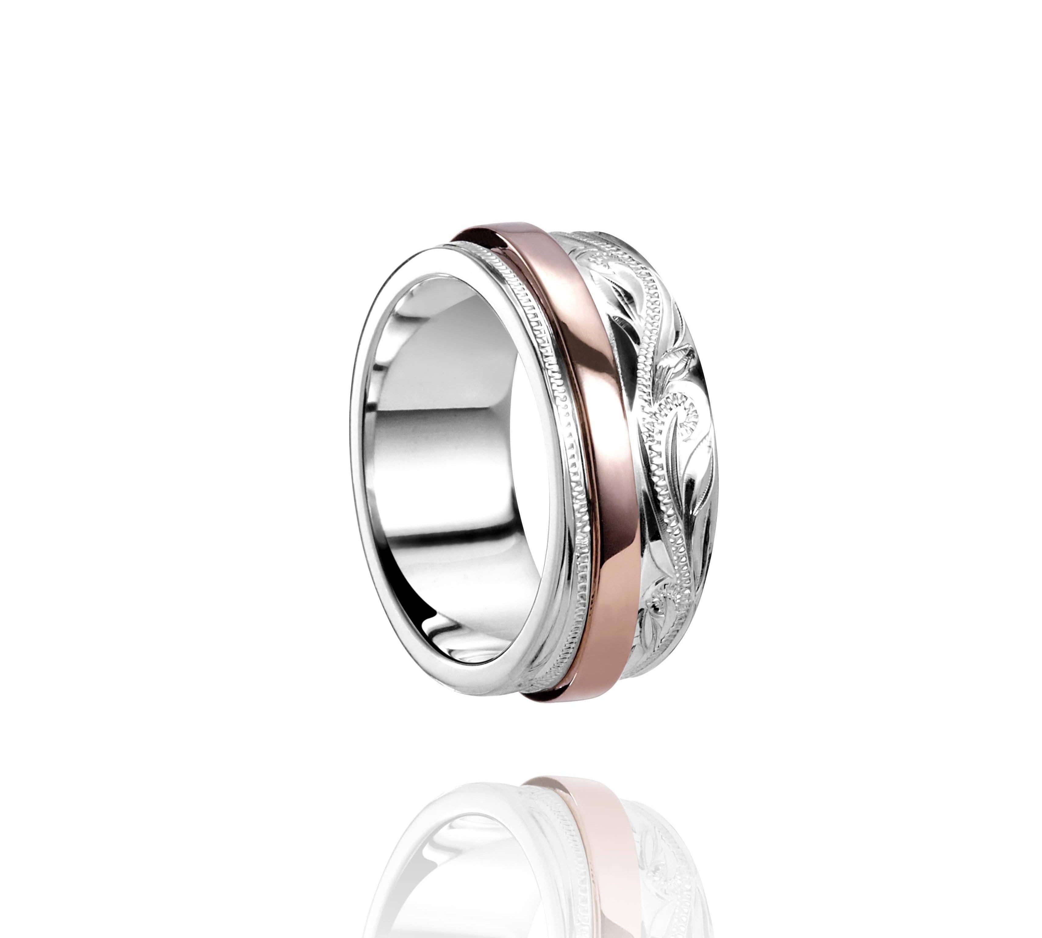 The picture shows a two-tone 925 sterling silver and 14K rose gold belted ring with hand-engravings.