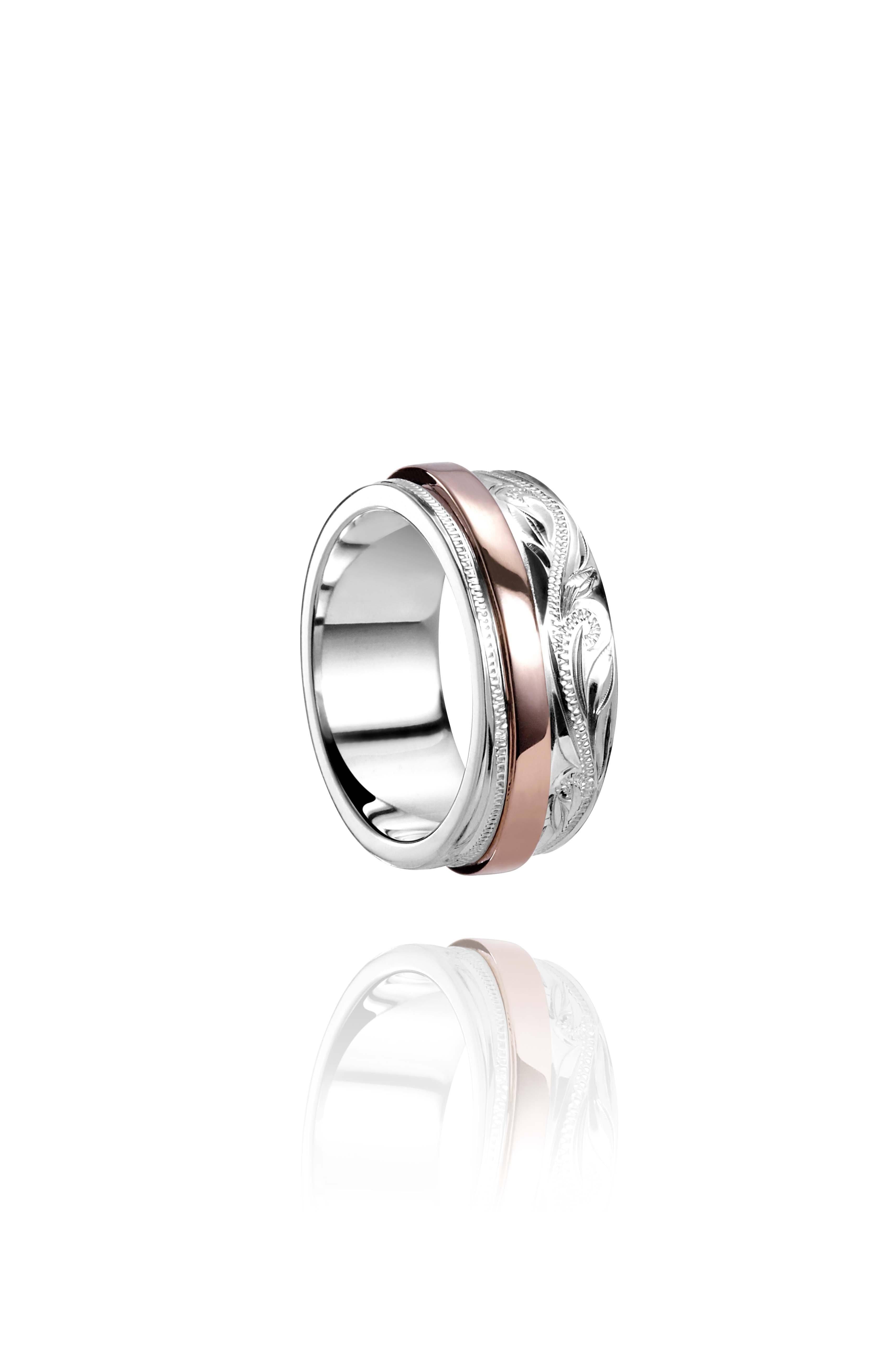 The picture shows a two-tone 925 sterling silver and 14K rose gold belted ring with hand-engravings.
