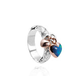 The picture shows a 14K rose gold and 925 sterling silver two-tone heart ring with hand engravings and opal.