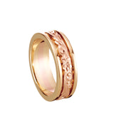 In this photo there is a yellow and rose gold two-tone ring with flower and scroll hand-engravings.