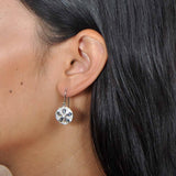 Abalone Pavé Sand Dollar Hook Earrings Earrings Island by Koa Nani Abalone, Sterling silver, and pave sand dollar earrings worn by a model. 