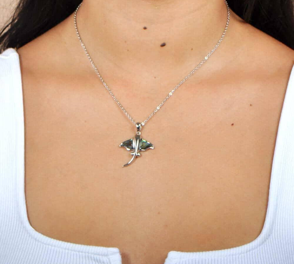 Abalone Sterling Silver Pendant designed as a stingray, worn by a model. 