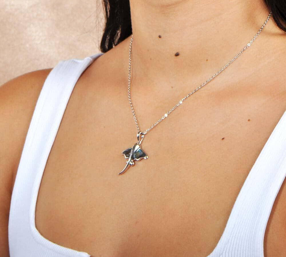 Abalone Sterling Silver Pendant designed as a stingray, worn by a model. 
