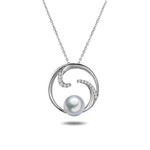 In this photo there is a white gold circle pendant with diamonds and one white Akoya pearl.