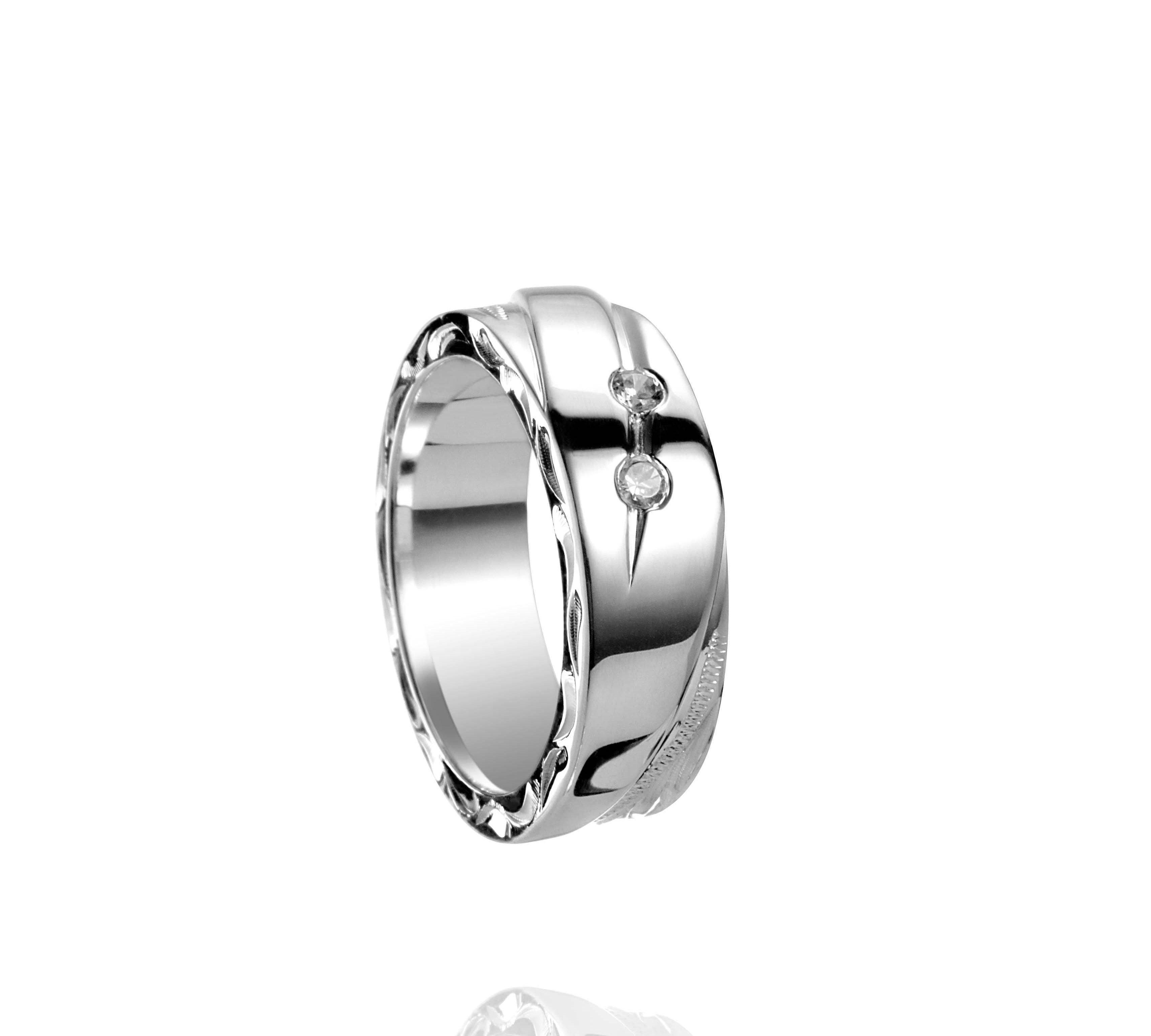 The picture shows a 925 sterling silver ring with diamonds and hand-engravings.