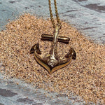 14k yellow gold anchor pendant featuring a hand-engraved sea turtle design