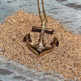 14k yellow gold anchor pendant featuring a hand-engraved sea turtle design