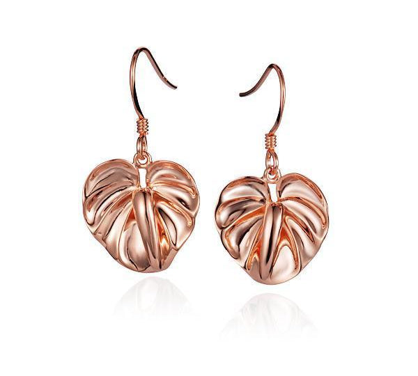 This picture shows a pair of 14K rose gold anthurium flower hook earrings.