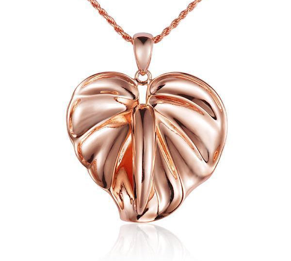 In this photo there is a rose gold anthurium flower pendant.