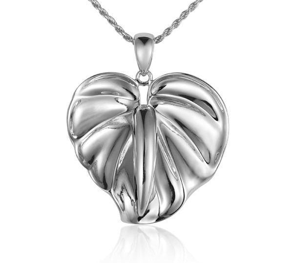 In this photo there is a white gold anthurium flower pendant.