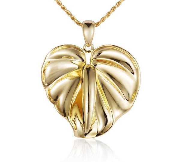 In this photo there is a yellow gold anthurium flower pendant.