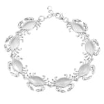 The picture shows a 925 sterling silver white gold-plated blue crab bracelet.